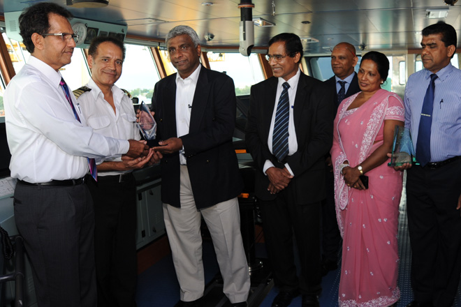 SLPA Chairman Mr.Dammika Ranatunga exchanging plaques with the Capt.of the vessel and Mr.Saliya Senanayake, Managing Director of SIMATECH Marine Lanka to mark the maiden call of  Mv. Sima Giselle in Colombo. Secretary to the Ministry of Ports and Shipping Mr. L.P. Jayampathi and Additional Secretary to the Ministry Mrs. Kanthi Perera, Chairman of Ceylon Shipping Corporation Ltd; - Mr. Sashi Dhanathunge, Vice Chairman of SLPA - Dr. Prasanna Perera, Executive Director- Mr. Sanjeewa Wijeratne, the Director (Operations) of SLPA – Mr.Upali De Zoysa and Director (Finance) – Mrs. Shirani Wanniarachchi are also in the picture.