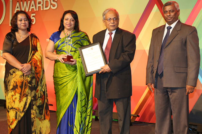 Photo Caption: The Deputy Secretary General / Financial Controller of the Ceylon Chamber of Commerce Mrs. Alikie Perera, receiving the award at the grand finale of the 51st Annual Report Awards Competition of the CA Sri Lanka.