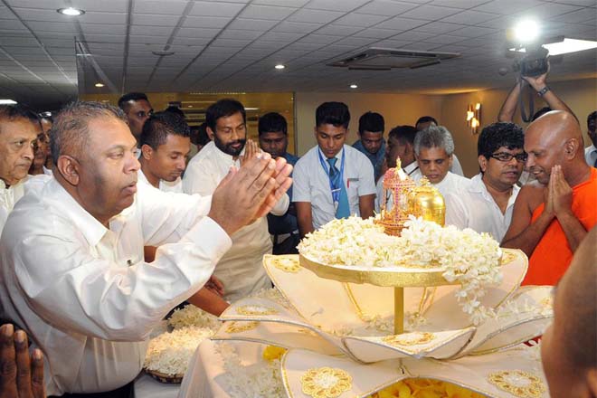 FM Mangala receives bone relics from Myanmar for Vesak viewing at the airport