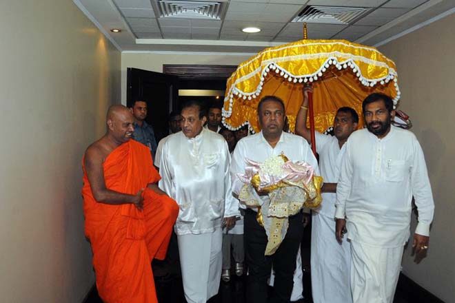 FM Mangala receives bone relics from Myanmar for Vesak viewing at the airport