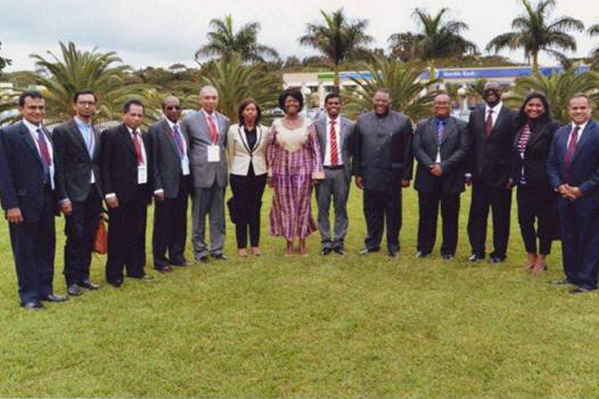 Participants posing for a photograph with their counterparts in Africa