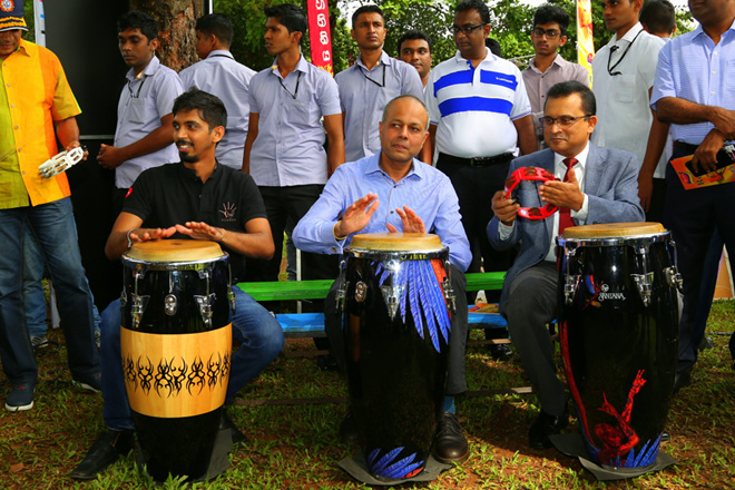 Minister Sagala plays drums at Naadro Bera Fest